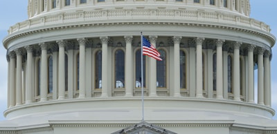 us a flag on white concrete building