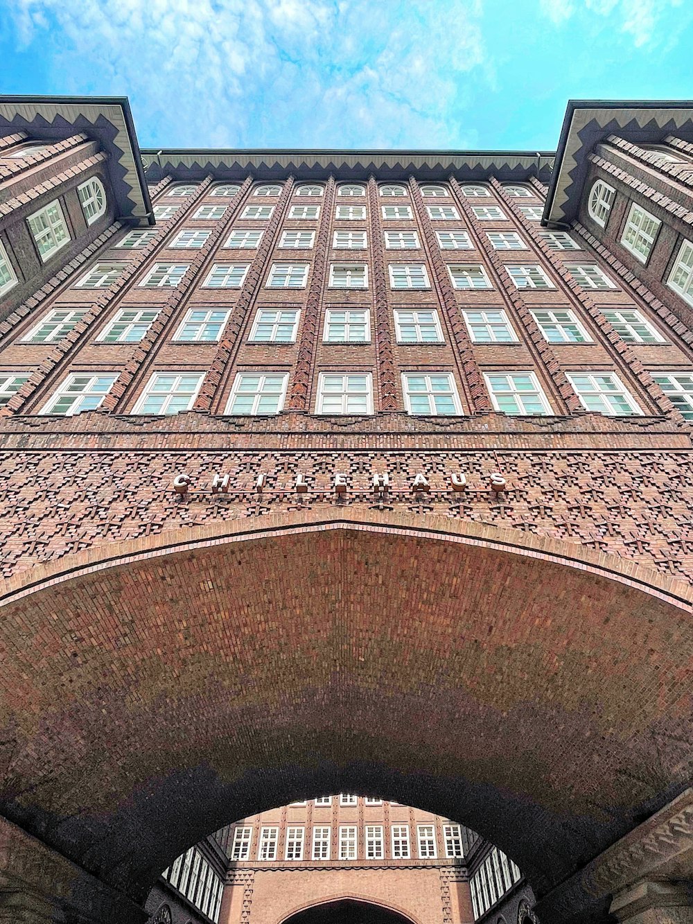 brown brick building under blue sky during daytime