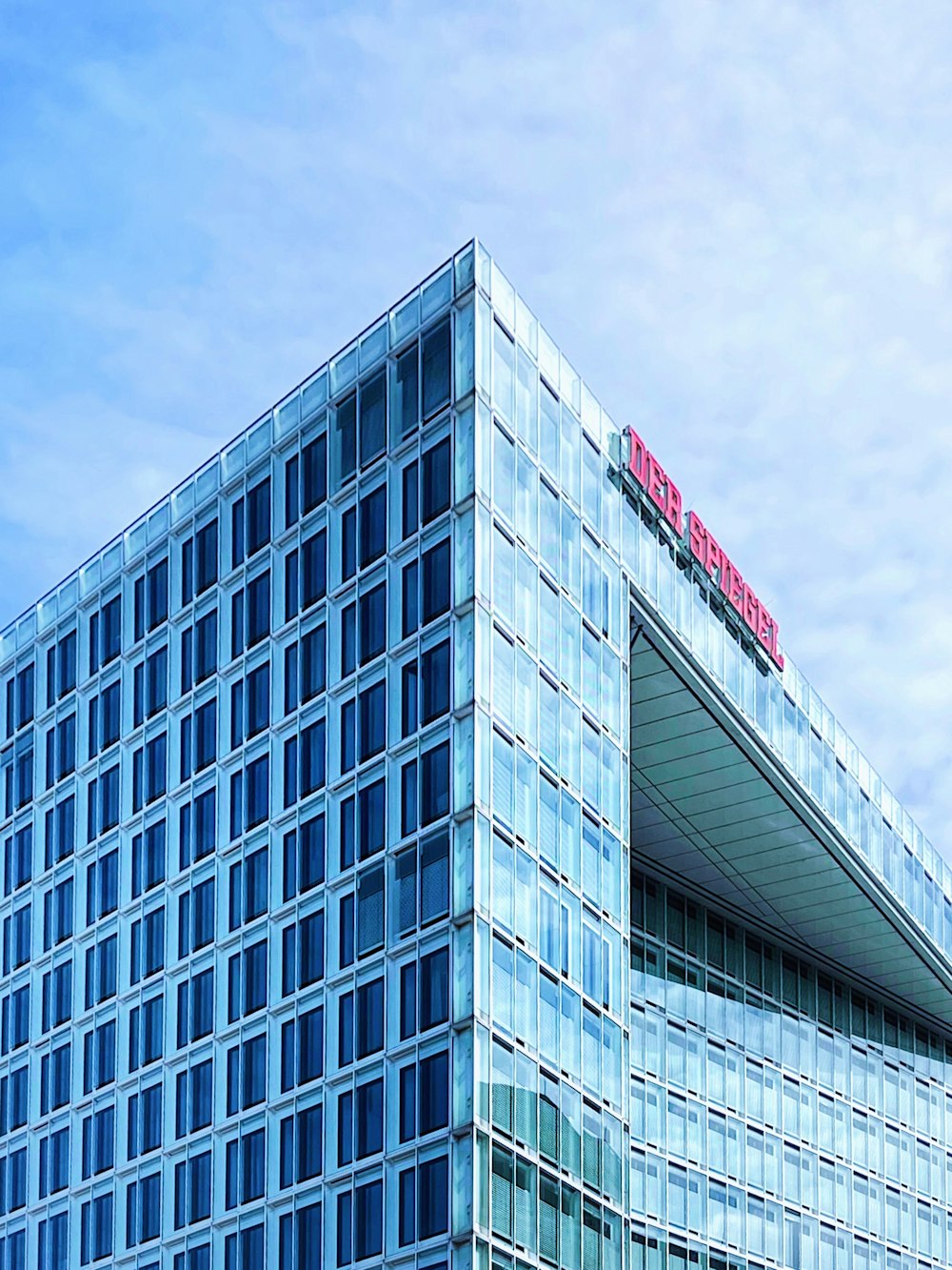 white and gray concrete building under blue sky during daytime