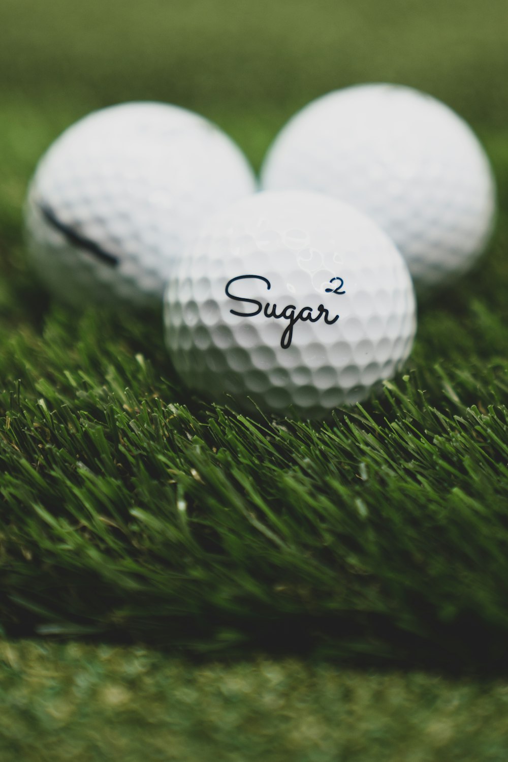 white golf ball on green grass