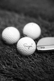 white golf ball on green grass during daytime
