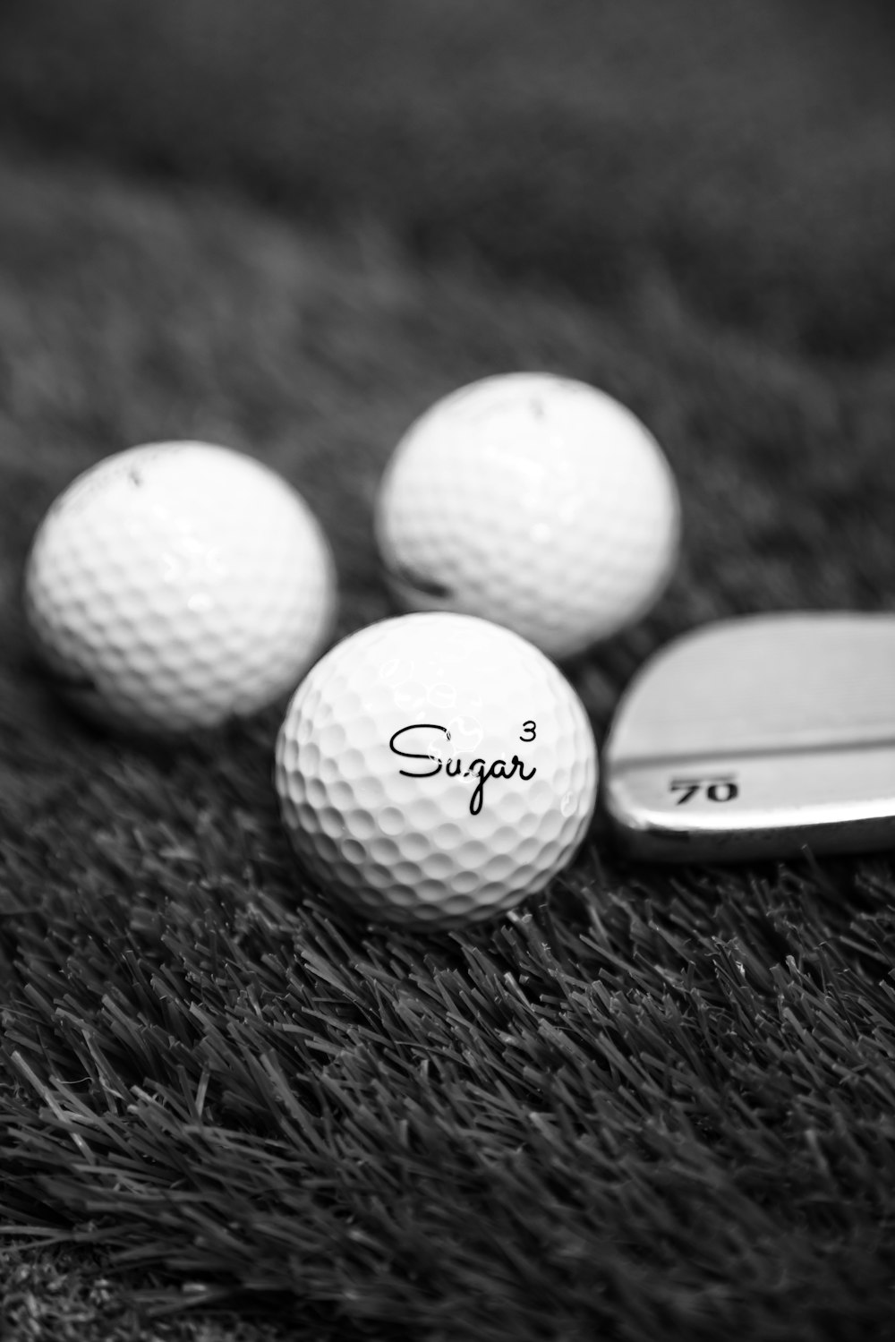 white golf ball on green grass during daytime