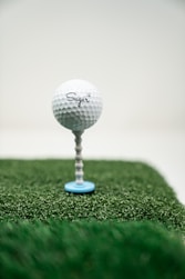 white golf ball on green grass