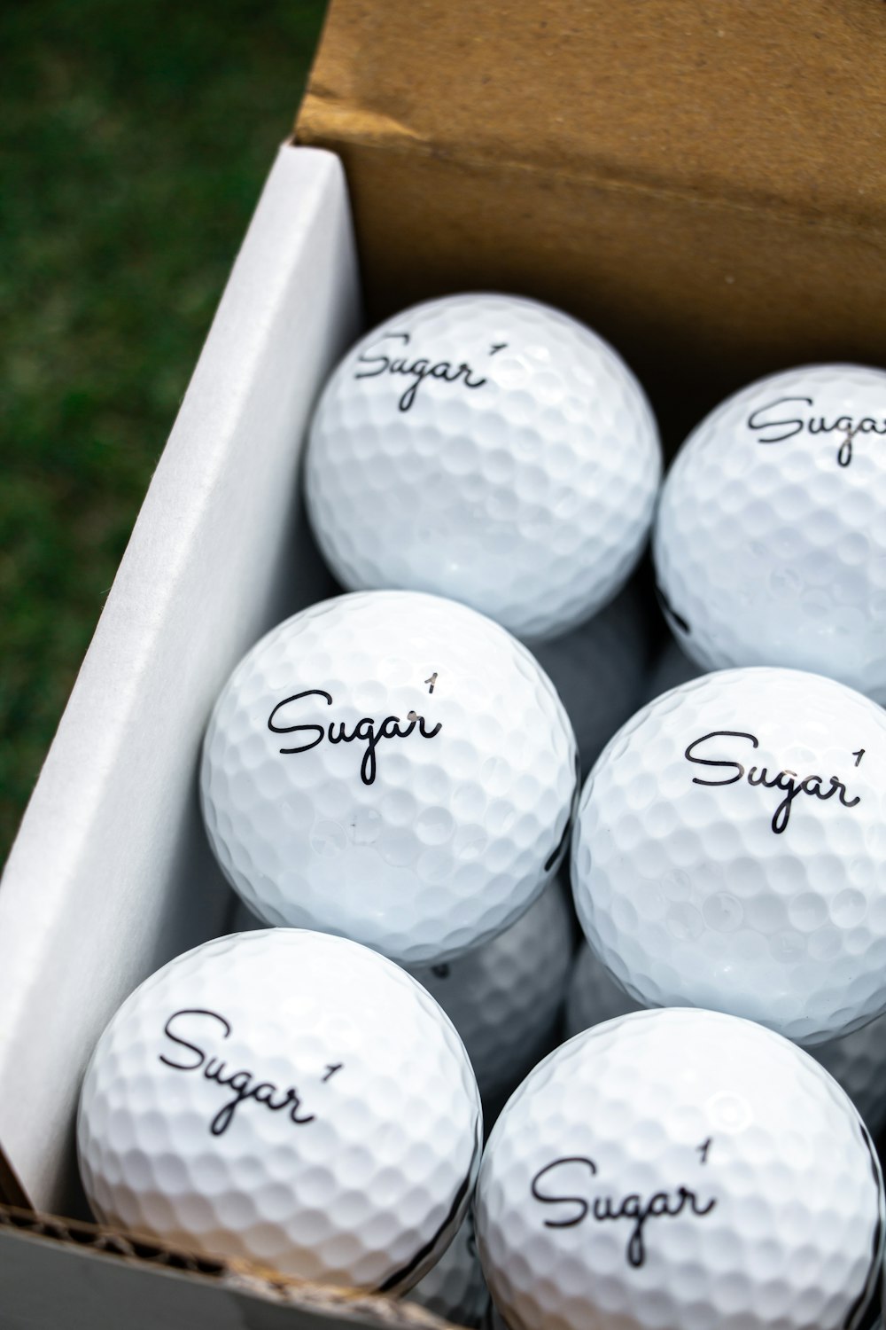 white golf ball in white golf bag