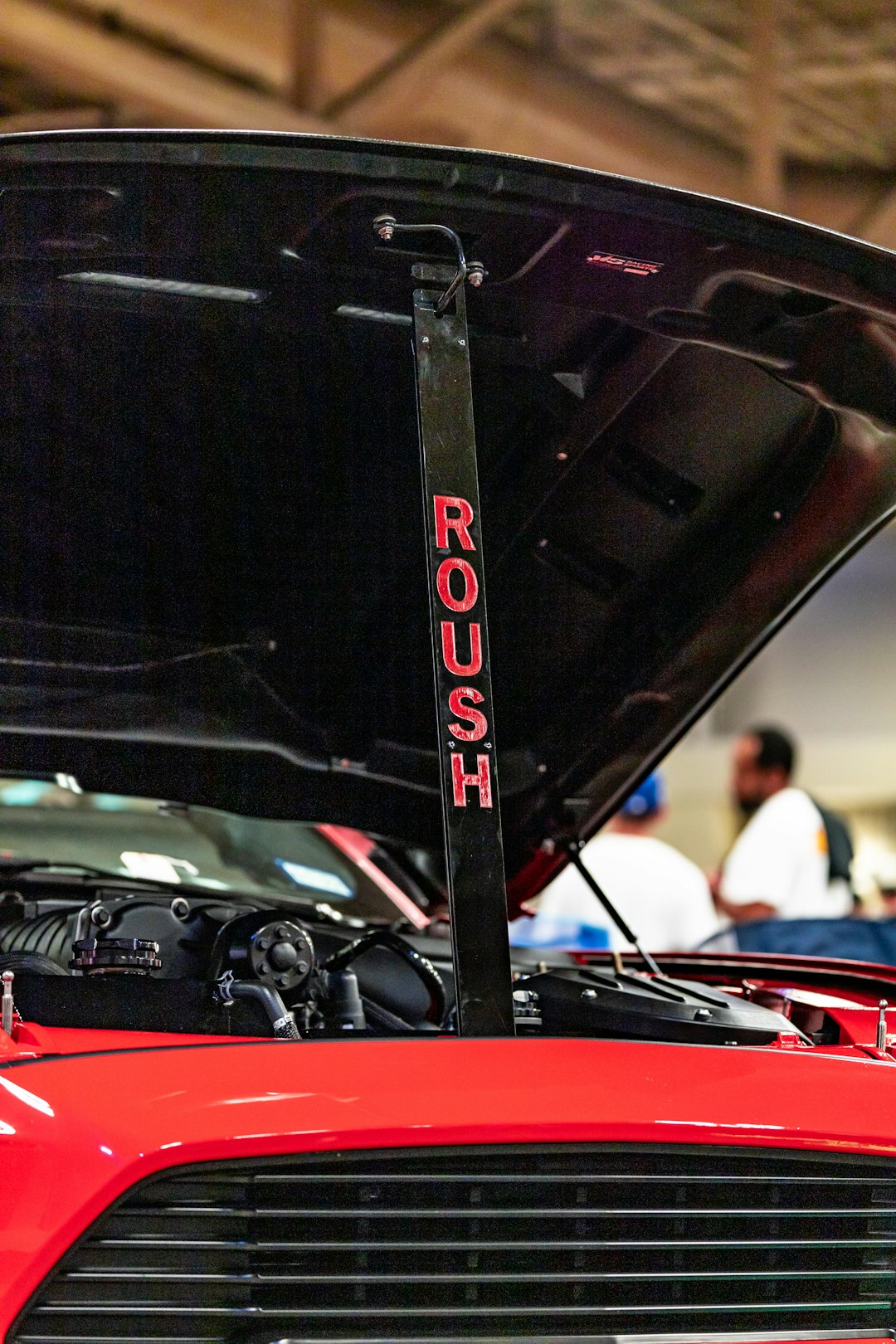 red and black car in a parking lot