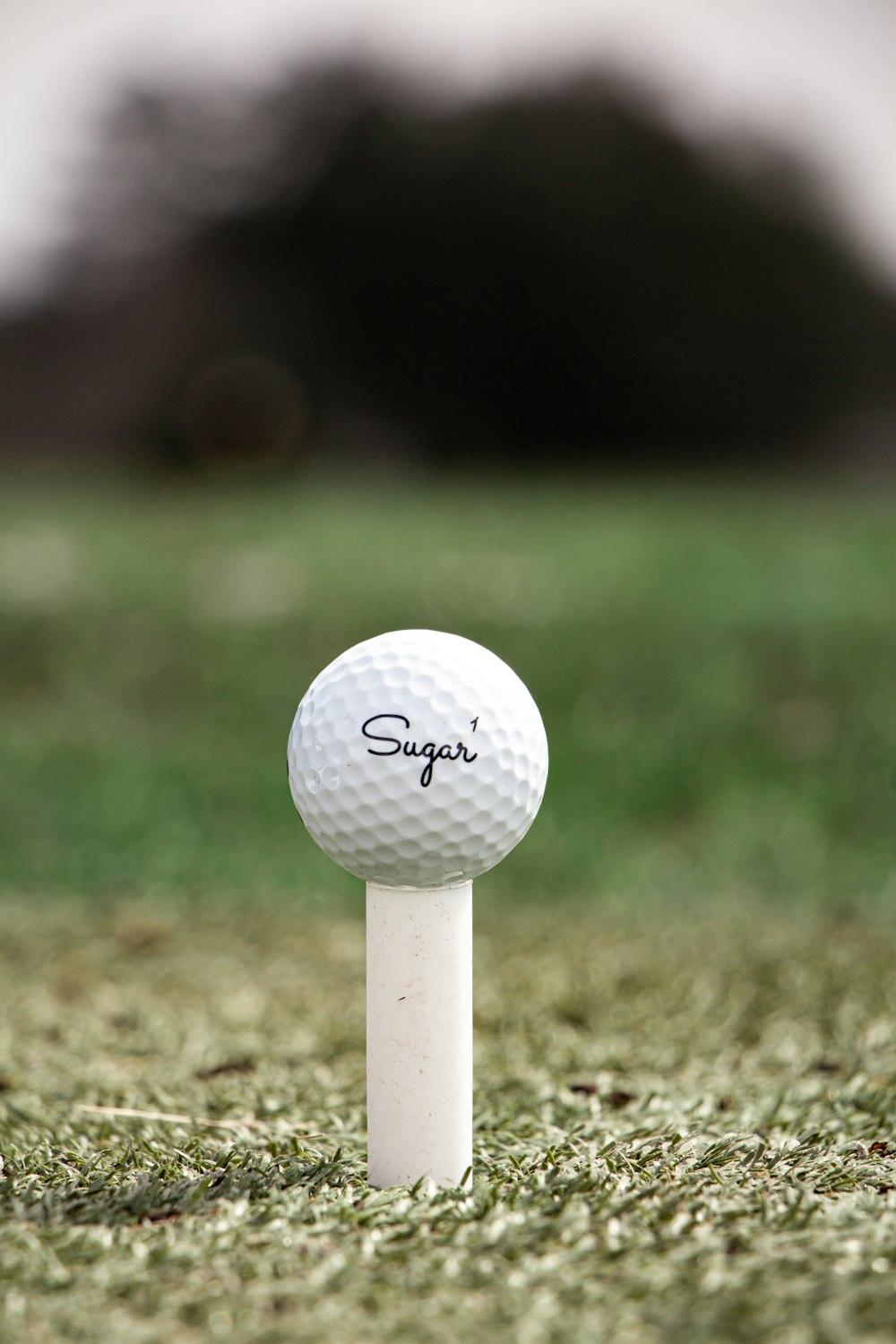 white golf ball on green grass field during daytime