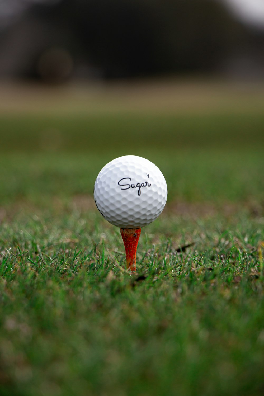 white golf ball on green grass field during daytime