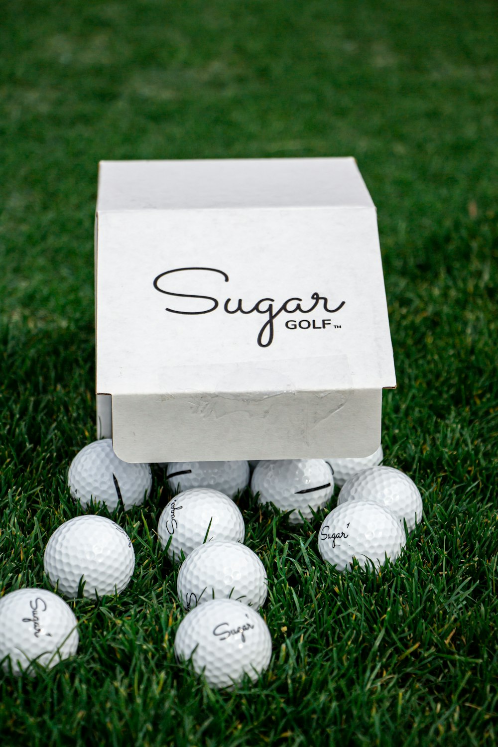 white golf ball on brown cardboard box