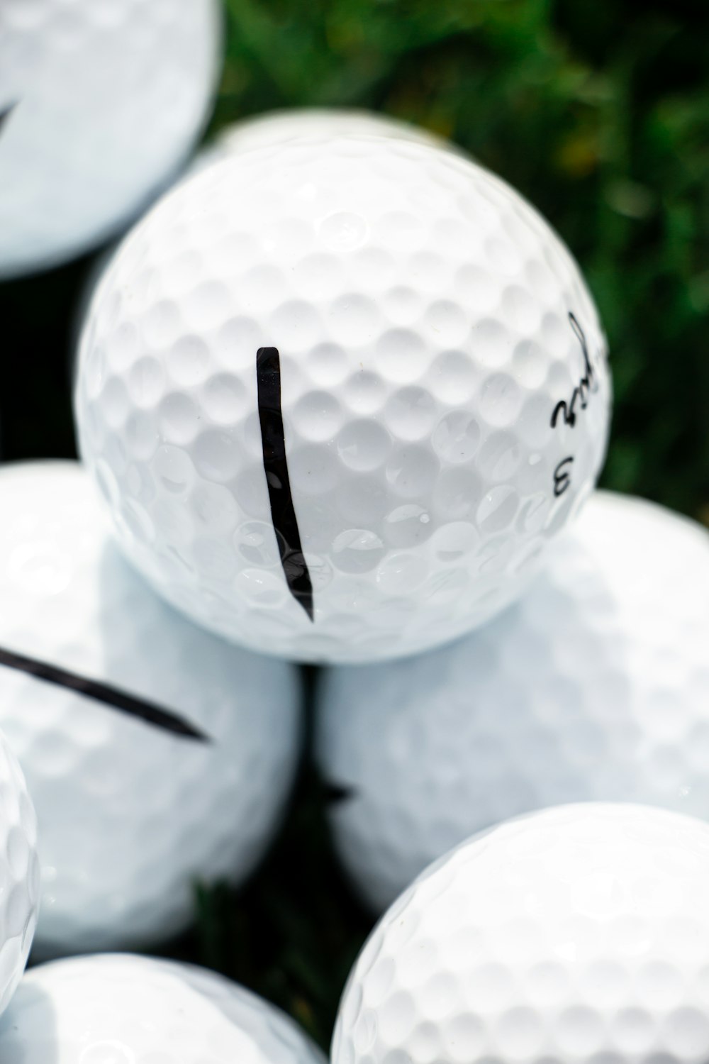 white golf ball on black background