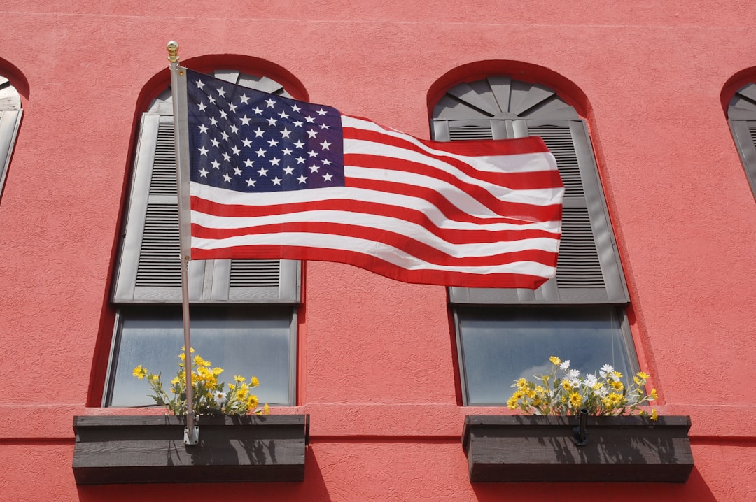 us a flag on brown wooden window