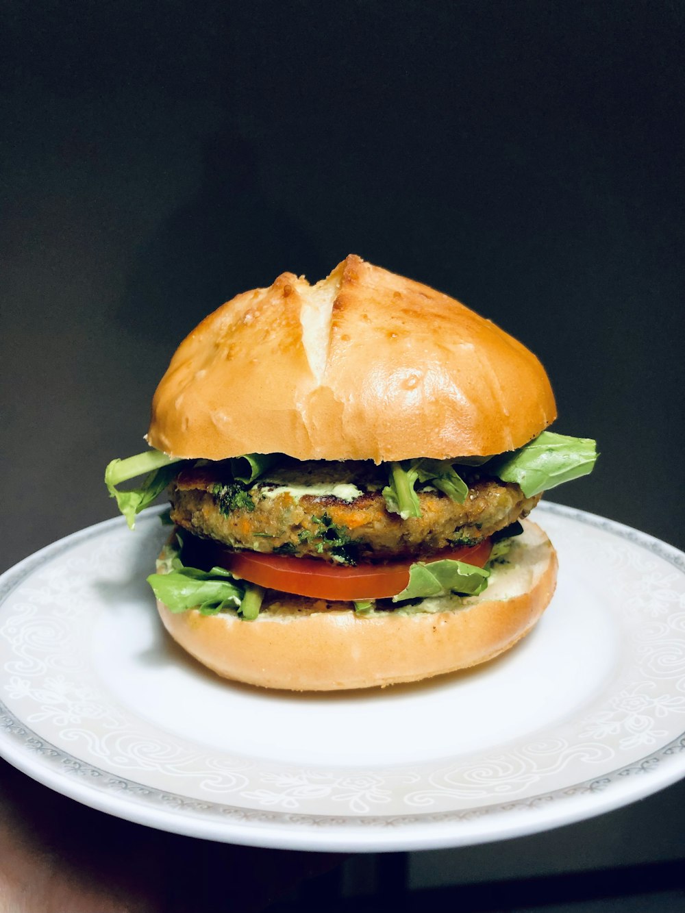 burger on white ceramic plate