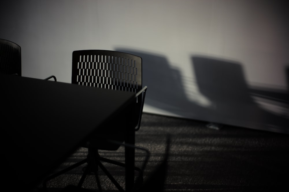 black wooden table and chairs