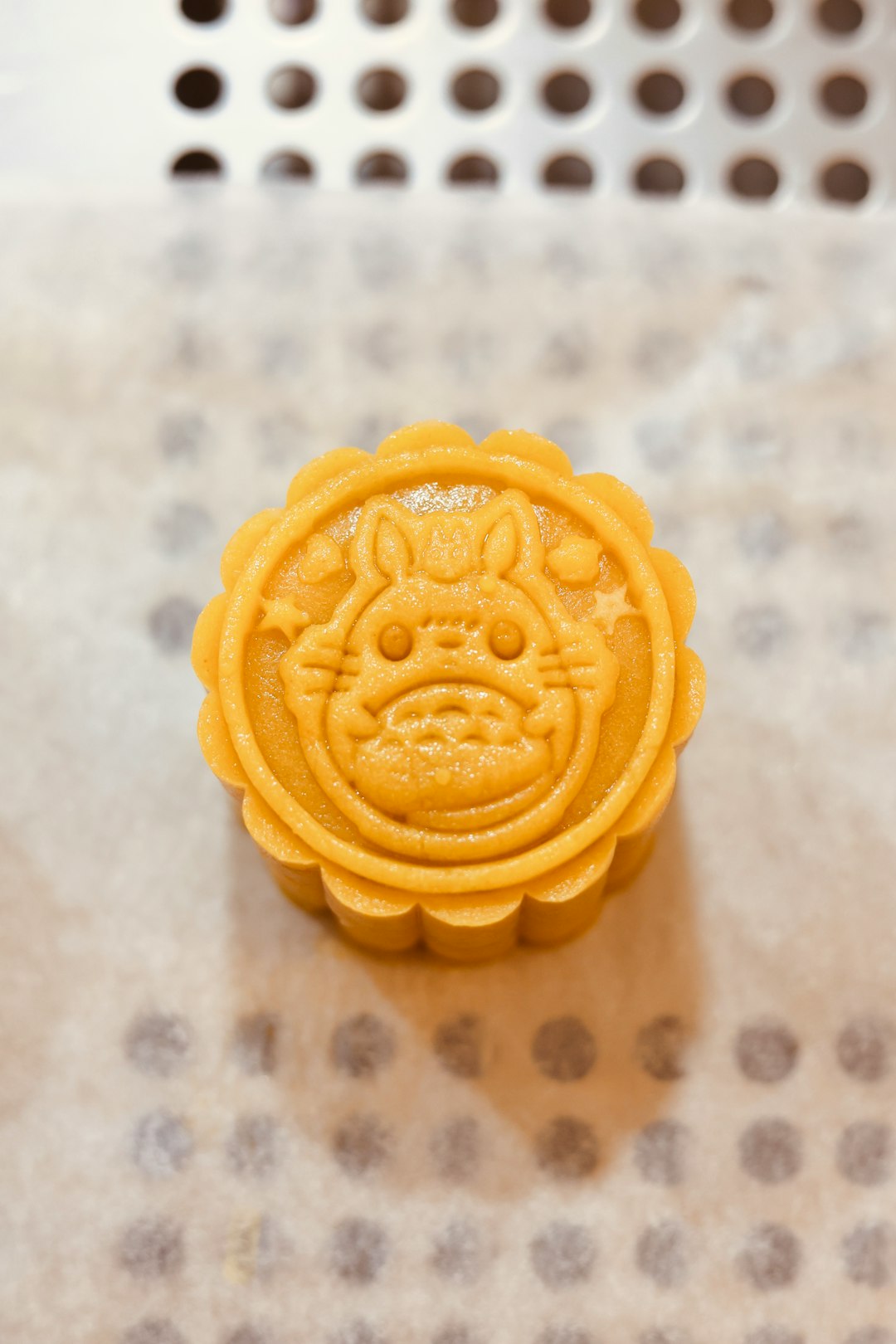 yellow cookie on white textile