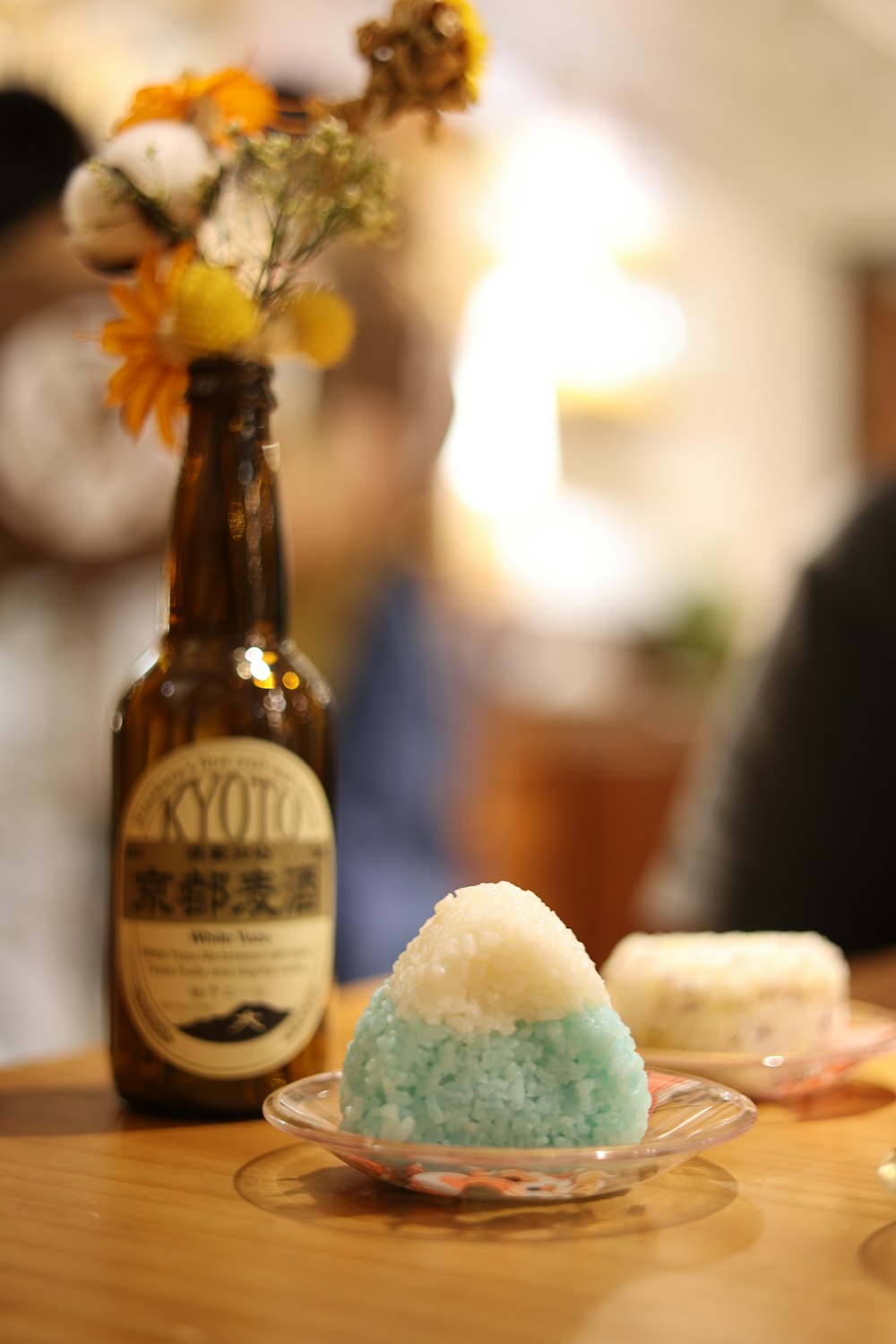 brown glass bottle on brown wooden table