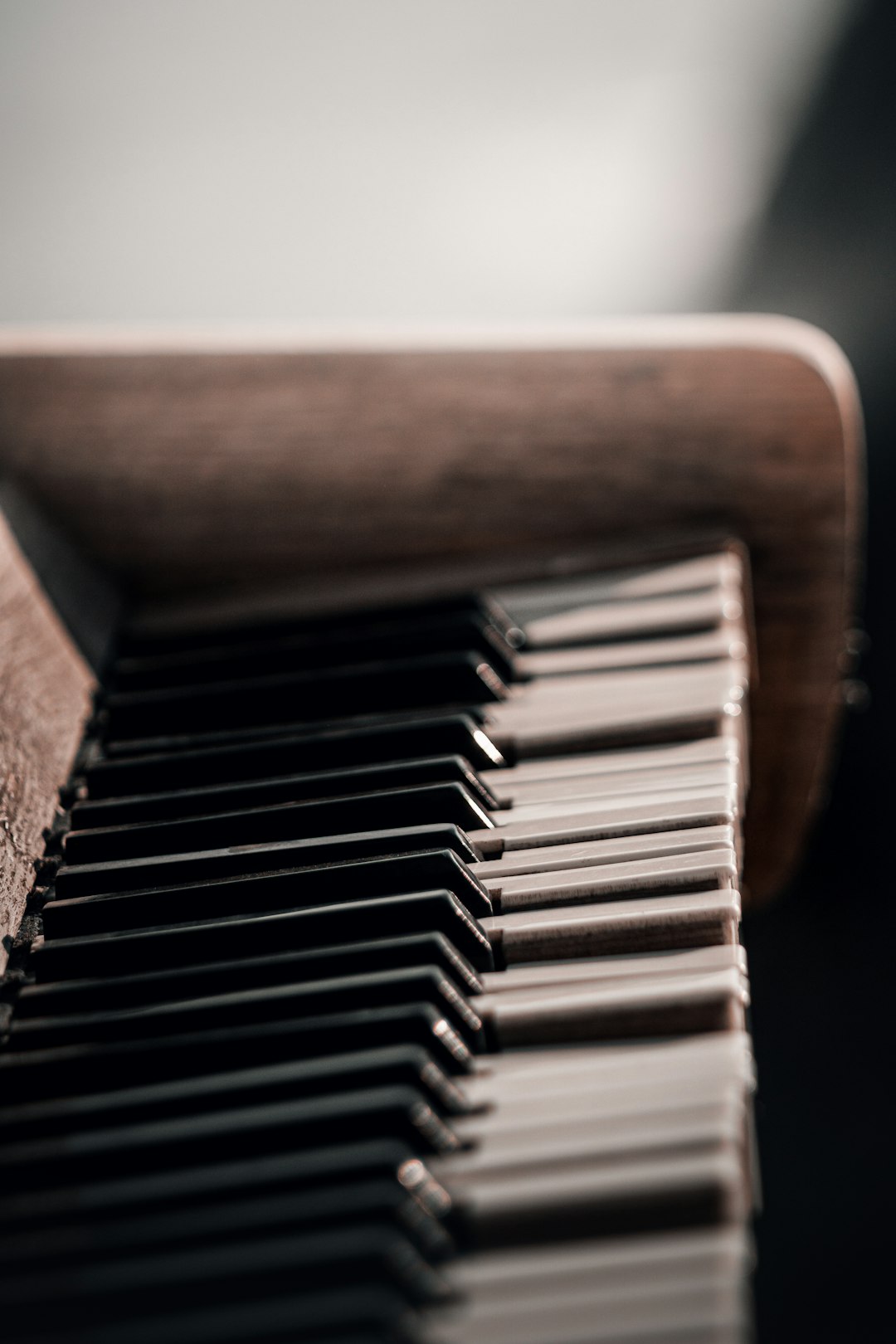 brown wooden piano in close up photography