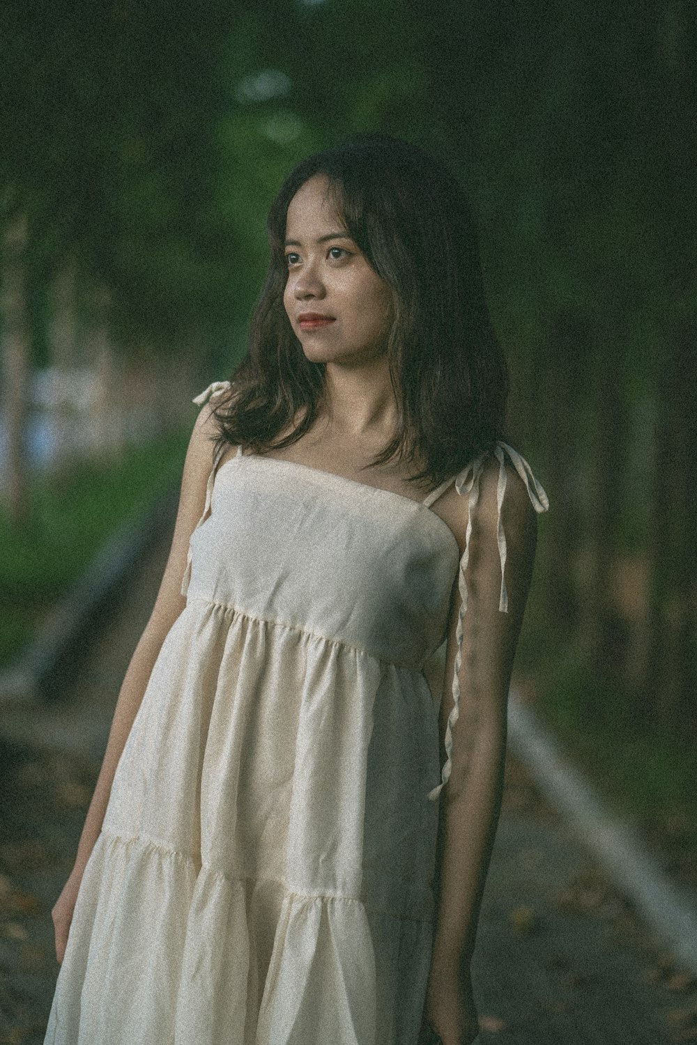 woman in white sleeveless dress