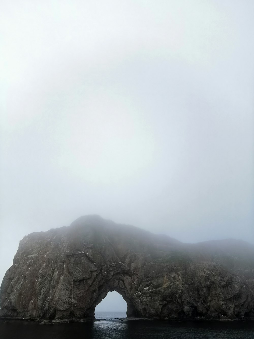 gray rocky mountain under white sky during daytime