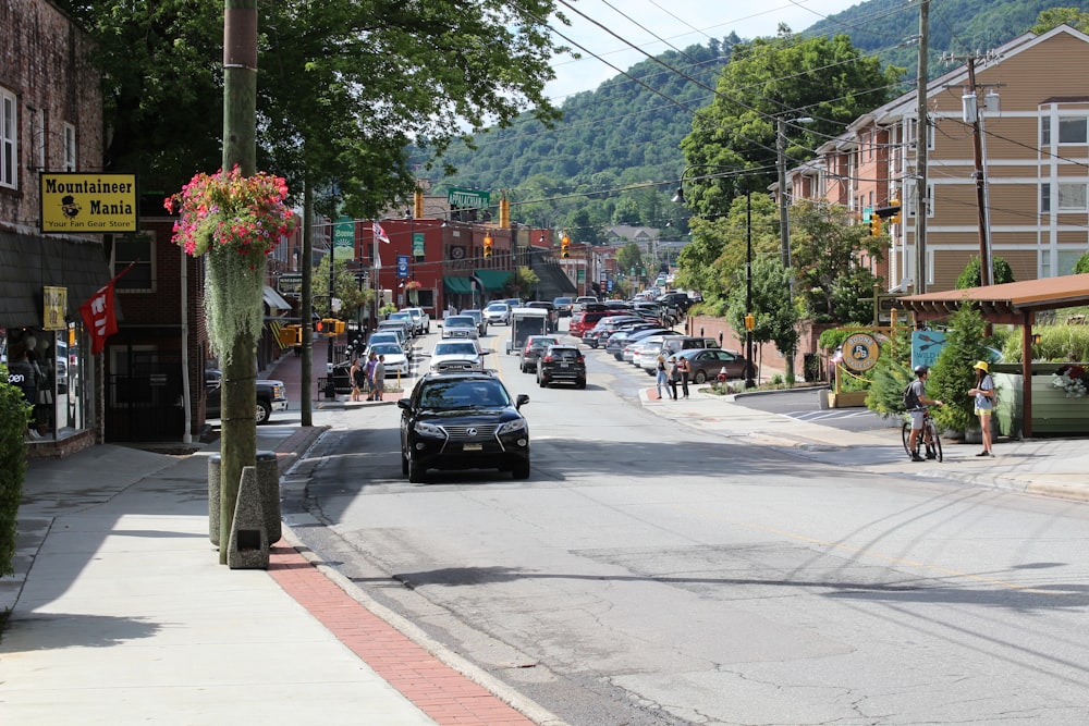 cars parked on sidewalk during daytime