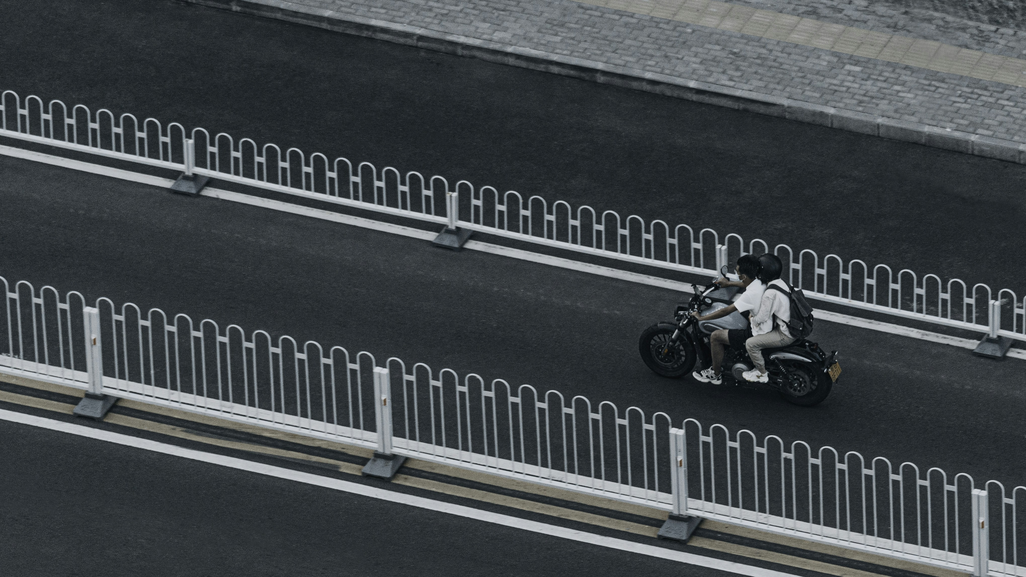 man in black jacket riding motorcycle on road during daytime