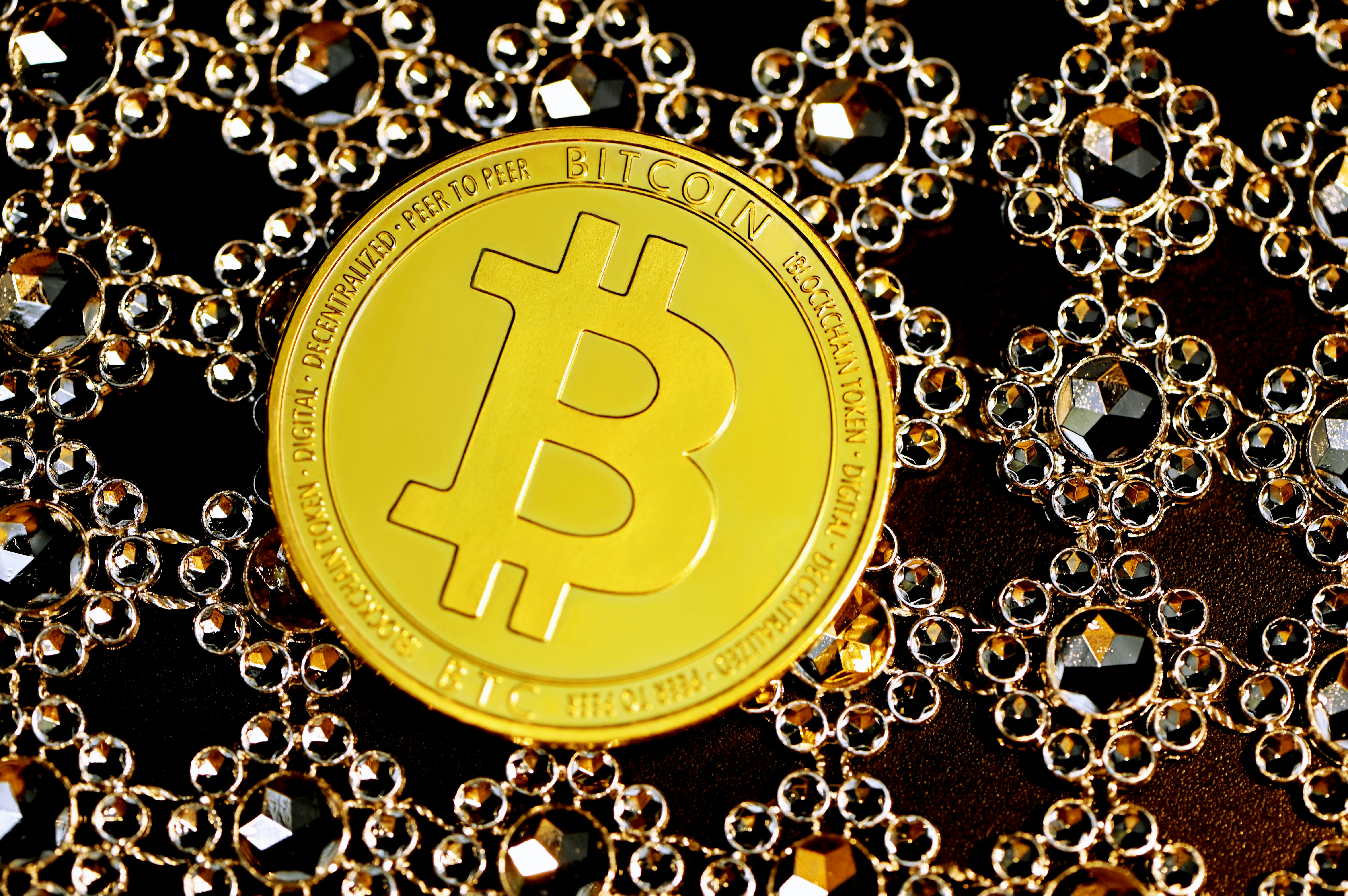 A Bitcoin on top of the jewelry