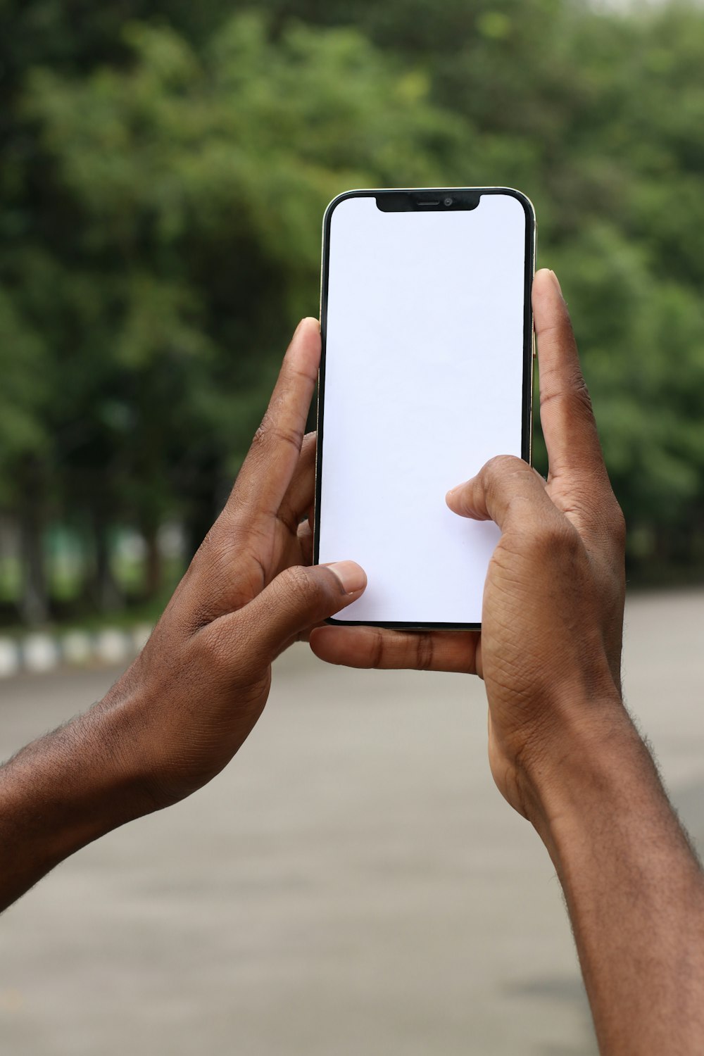 person holding white iphone 5 c