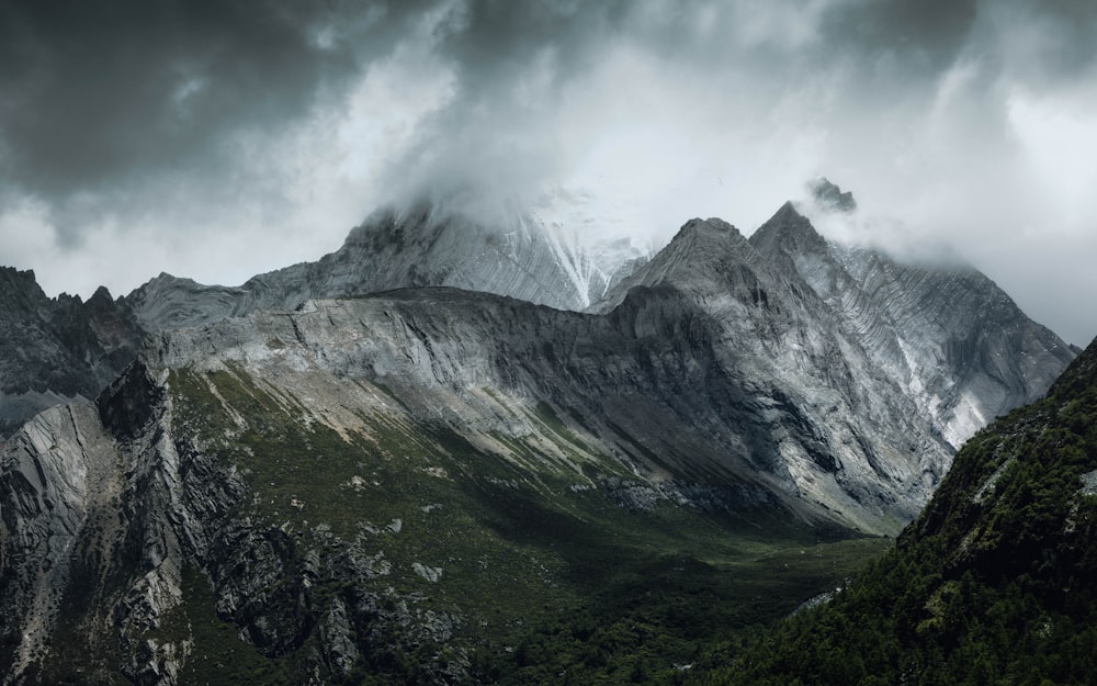 green and gray mountains under white clouds