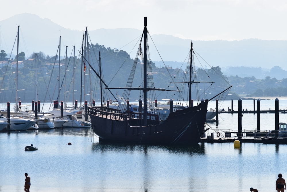 black and brown boat on water during daytime