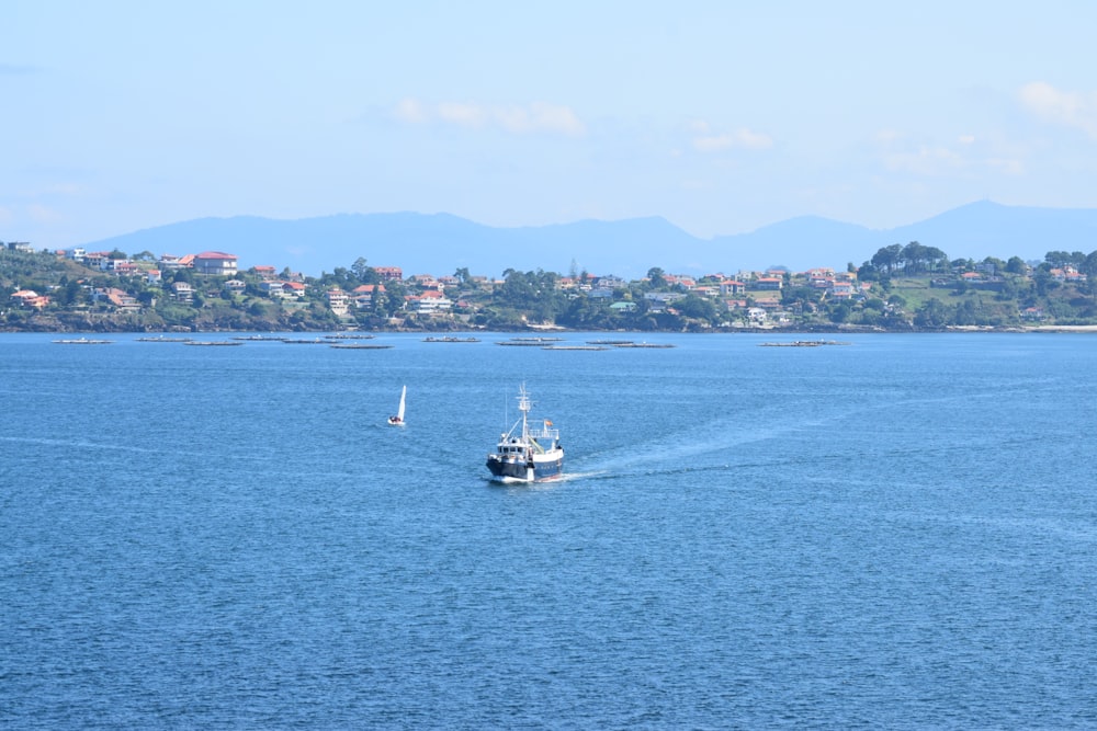 a boat in the middle of a large body of water