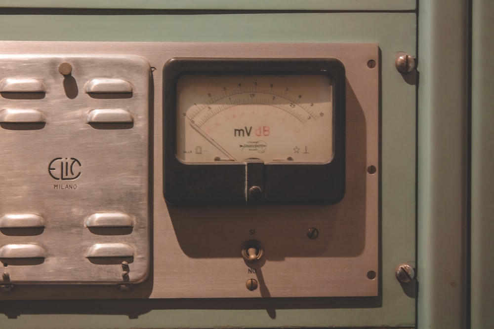 gray and brown analog meter