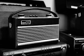 black and gray radio on black table