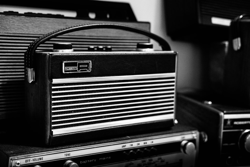 black and gray radio on black table