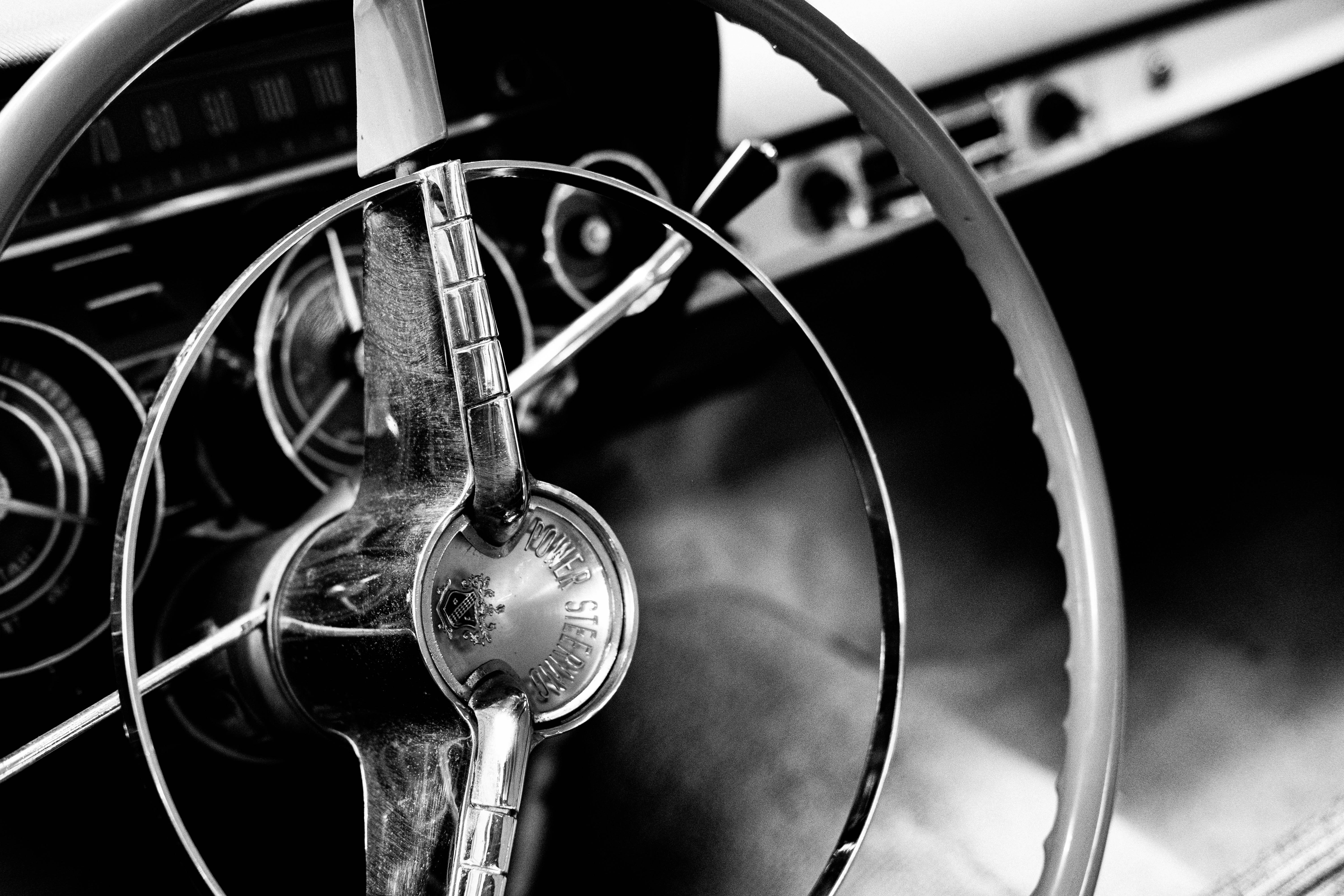 grayscale photo of steering wheel