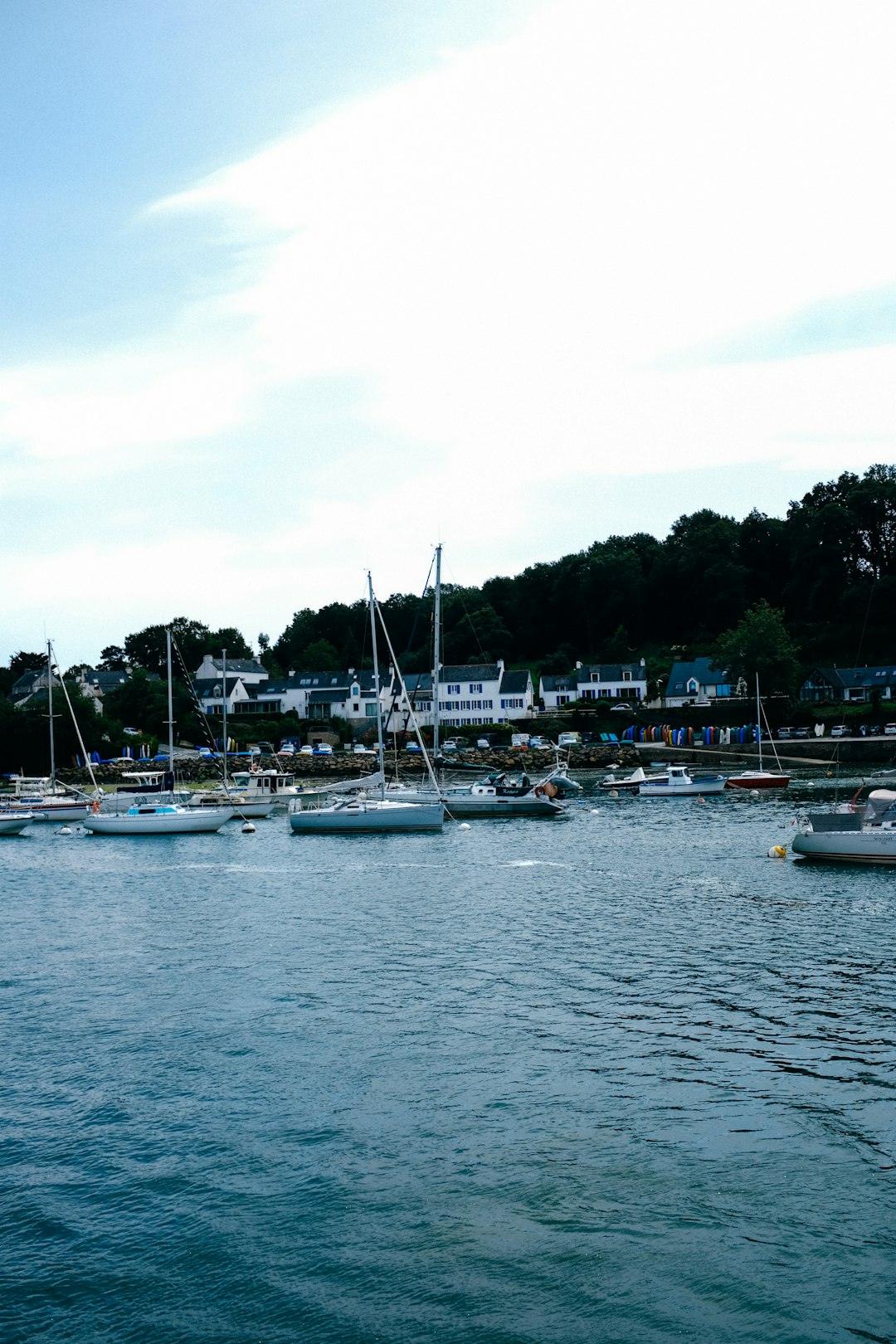 white and blue boats on sea during daytime