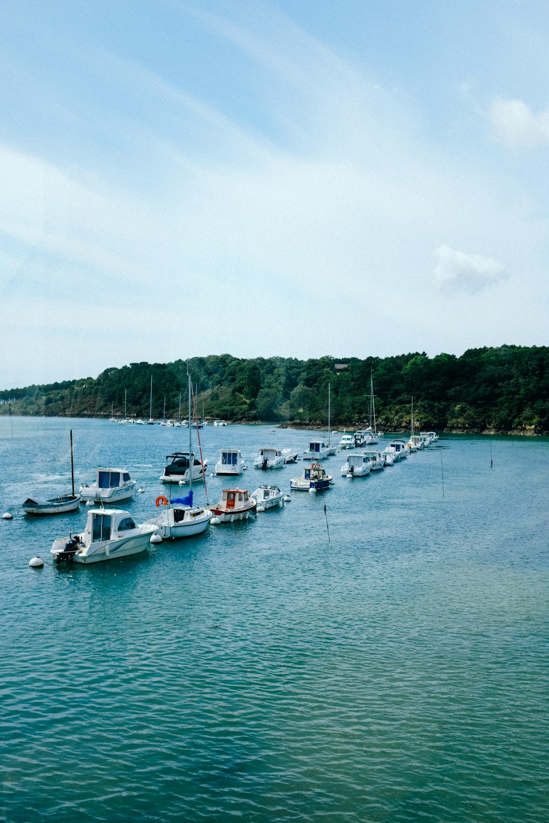 white boats on sea during daytime