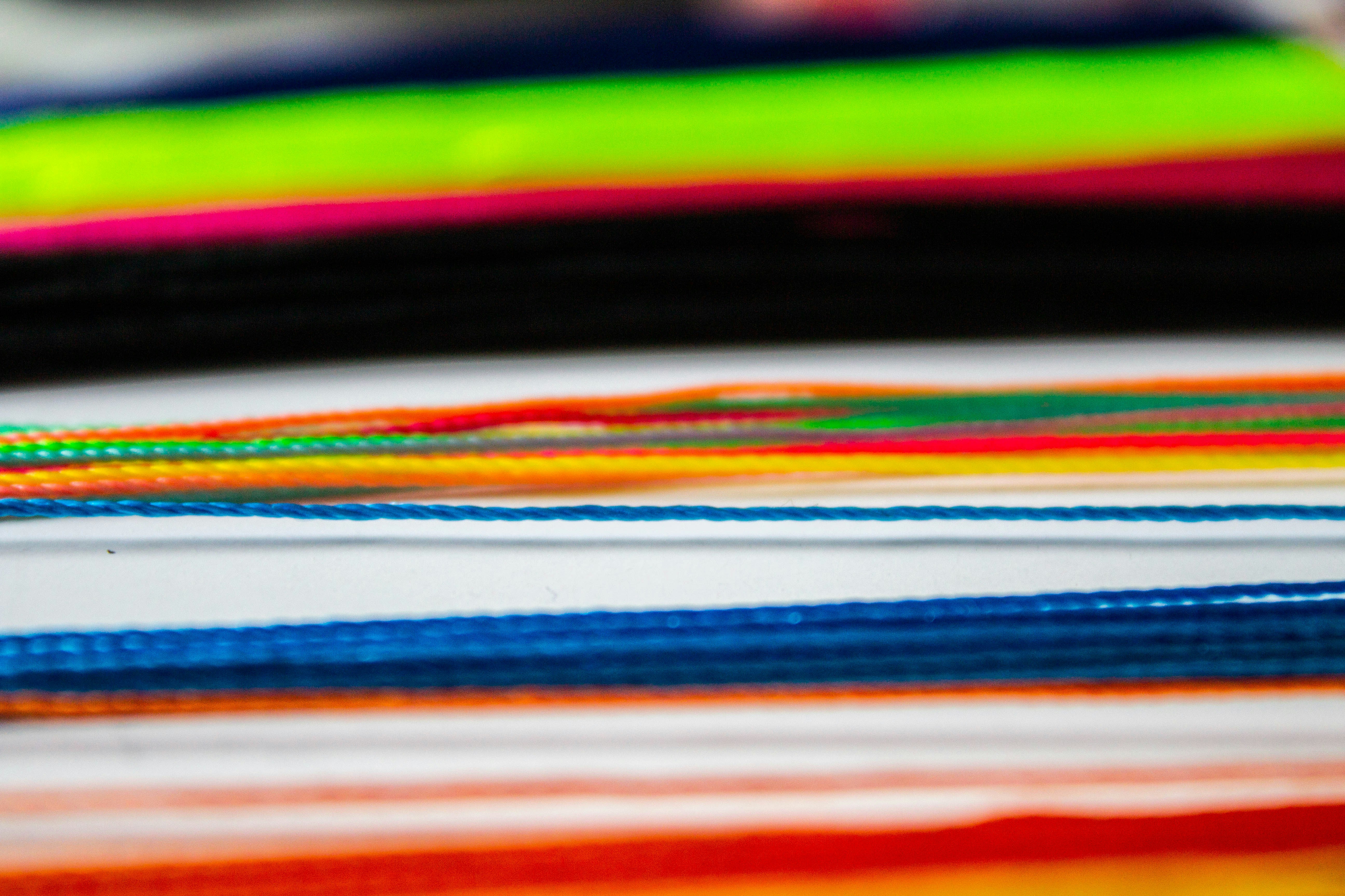 red blue green and white striped textile