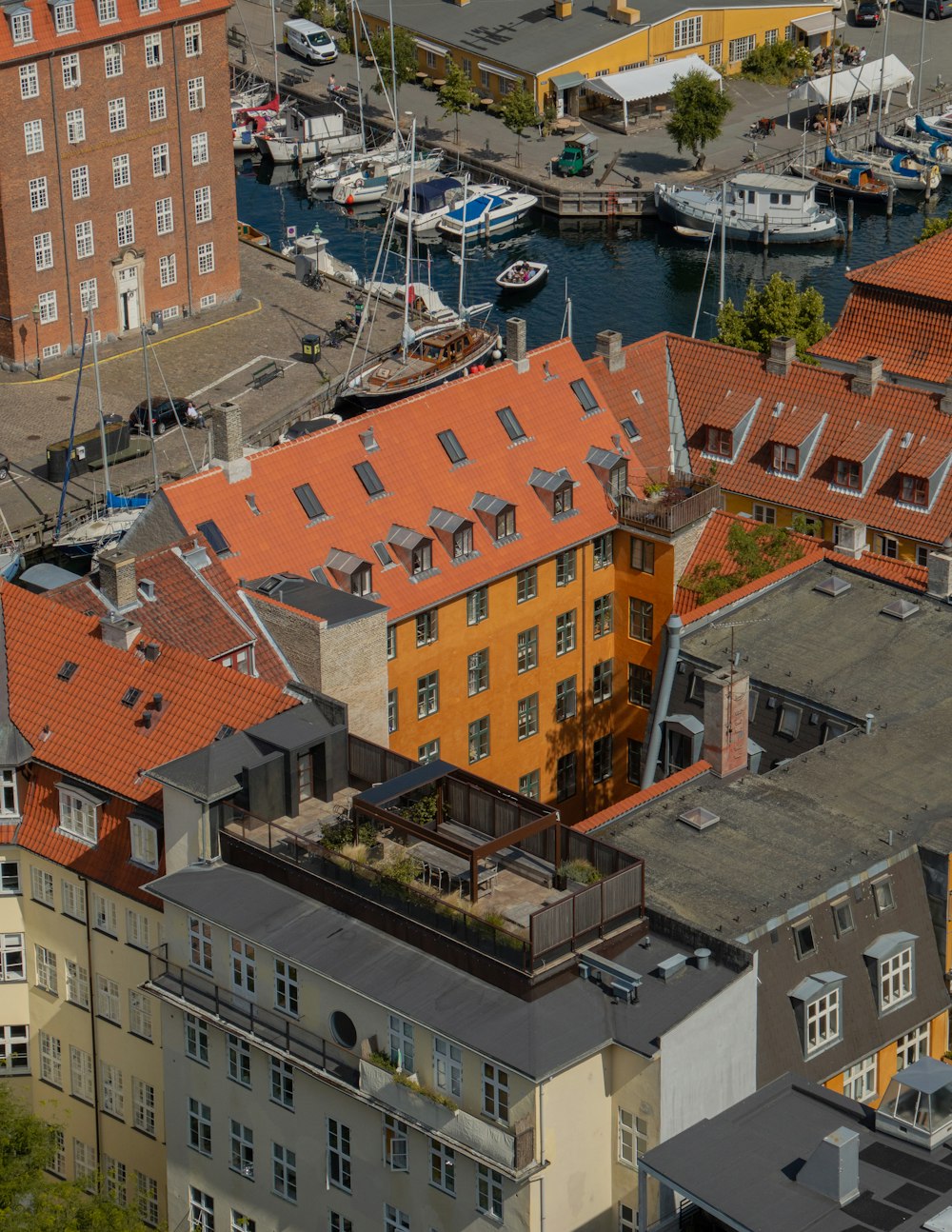 brown and white concrete buildings near body of water during daytime