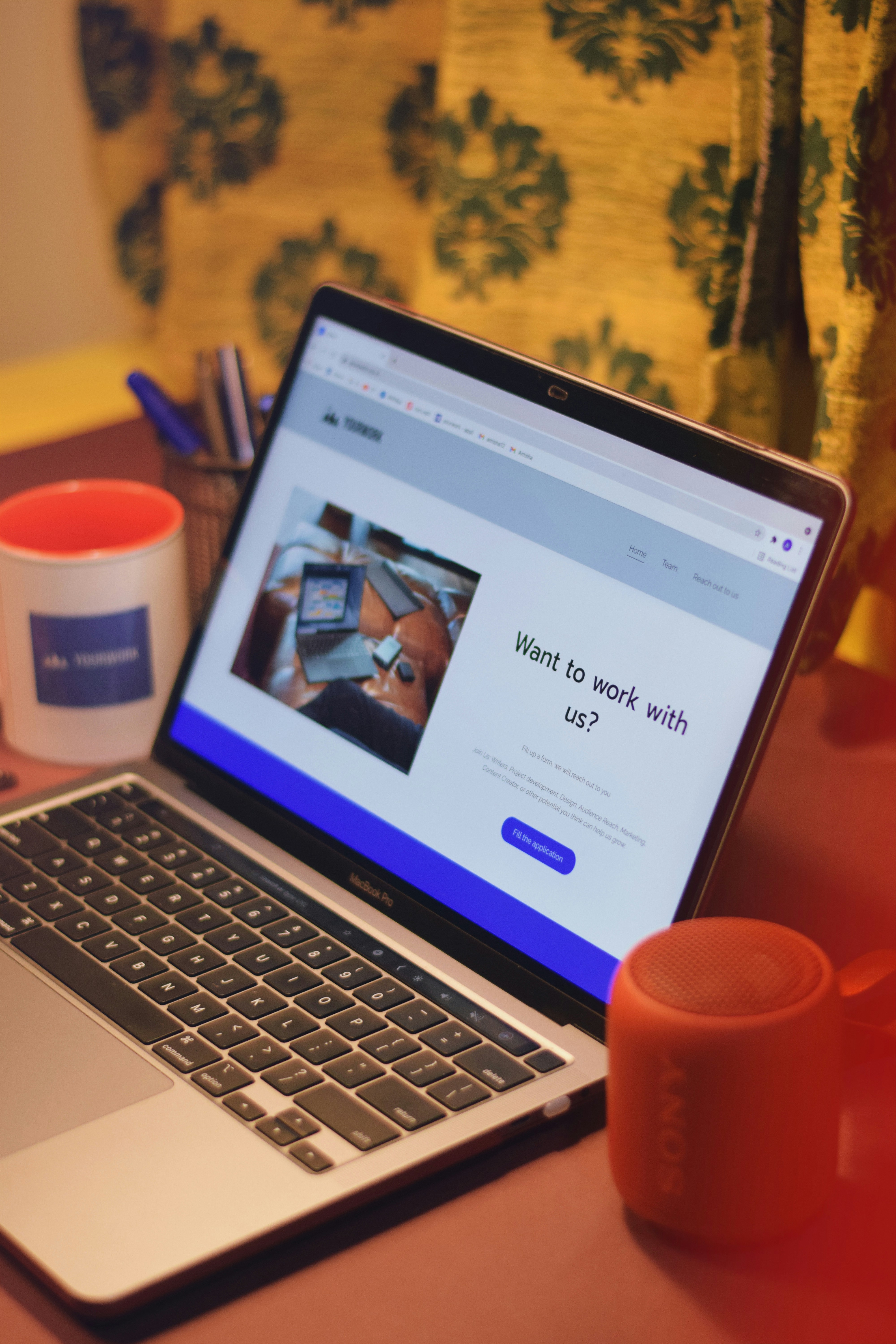Professional woman completing online application on laptop, representing the simple application process