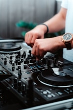 person wearing gold and silver round analog watch