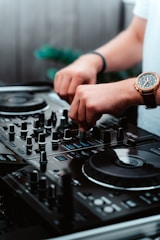 person wearing gold and silver round analog watch