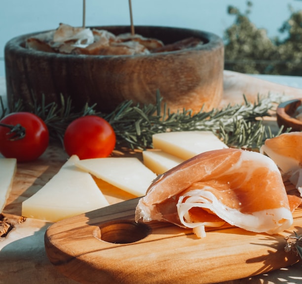 sliced meat on brown wooden chopping board