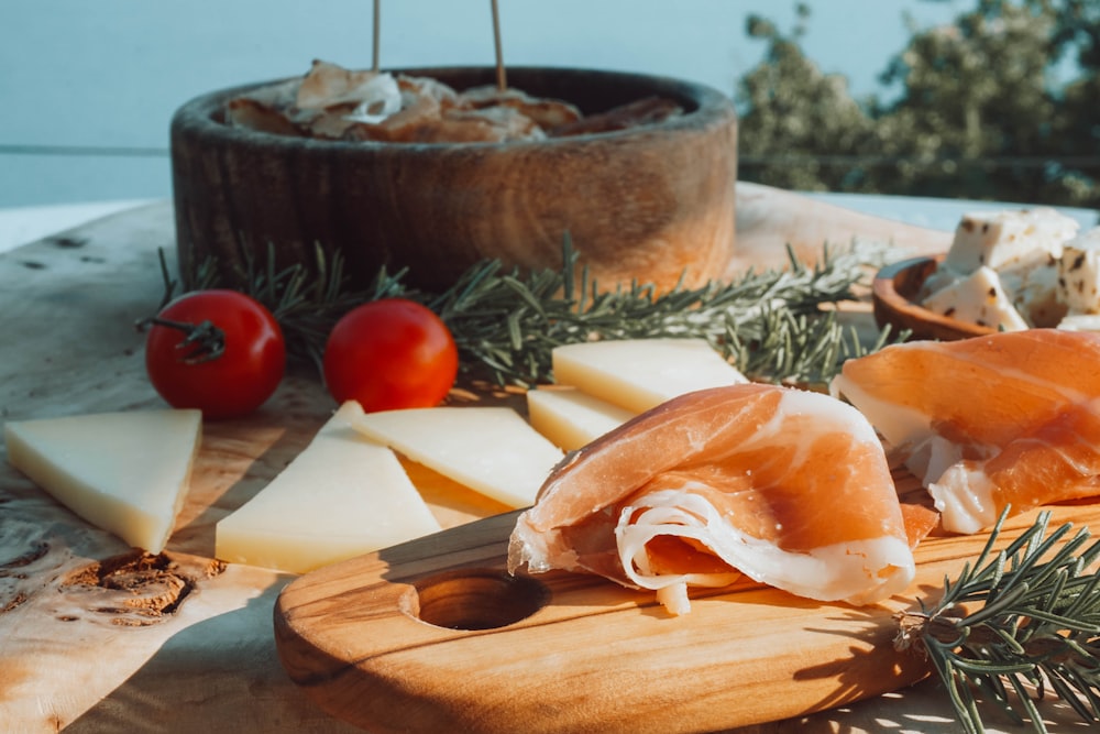 sliced meat on brown wooden chopping board