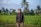 man in black jacket standing on green grass field during daytime