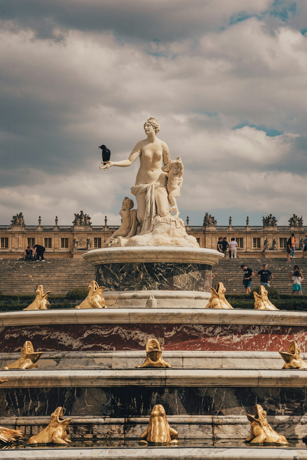 white concrete statue under cloudy sky during daytime