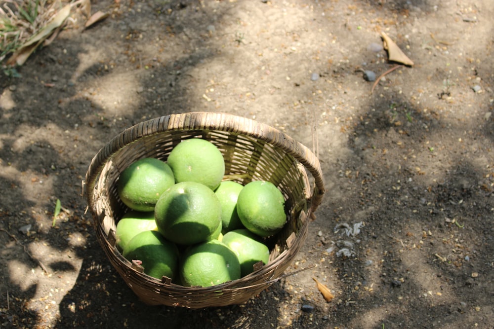 green apples in brown woven basket