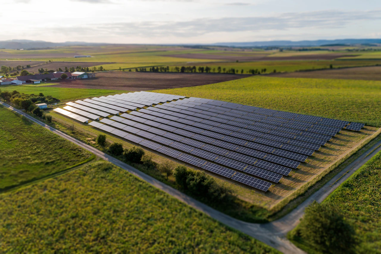 Solar panel array across a green field in rural Austria