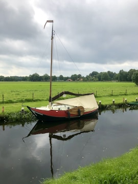 A sleek white canvas boat cover stretched tightly over a sailboat.