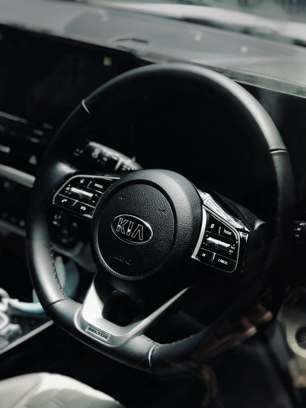 black and silver nissan steering wheel