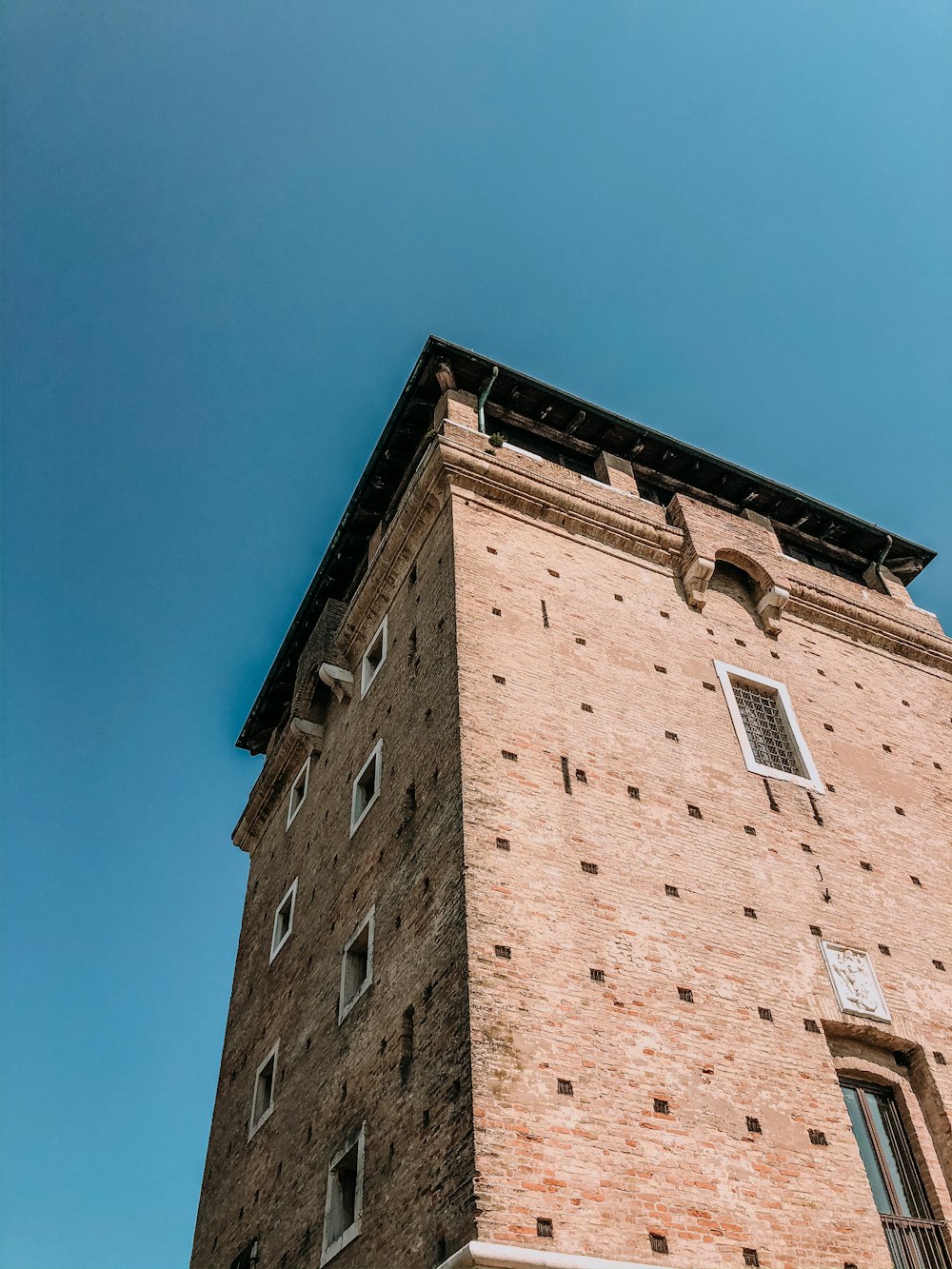 brown concrete building under blue sky during daytime