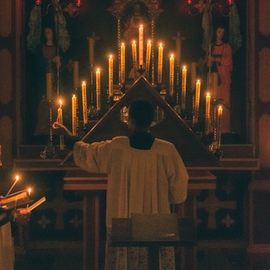 man in white thobe standing in front of church