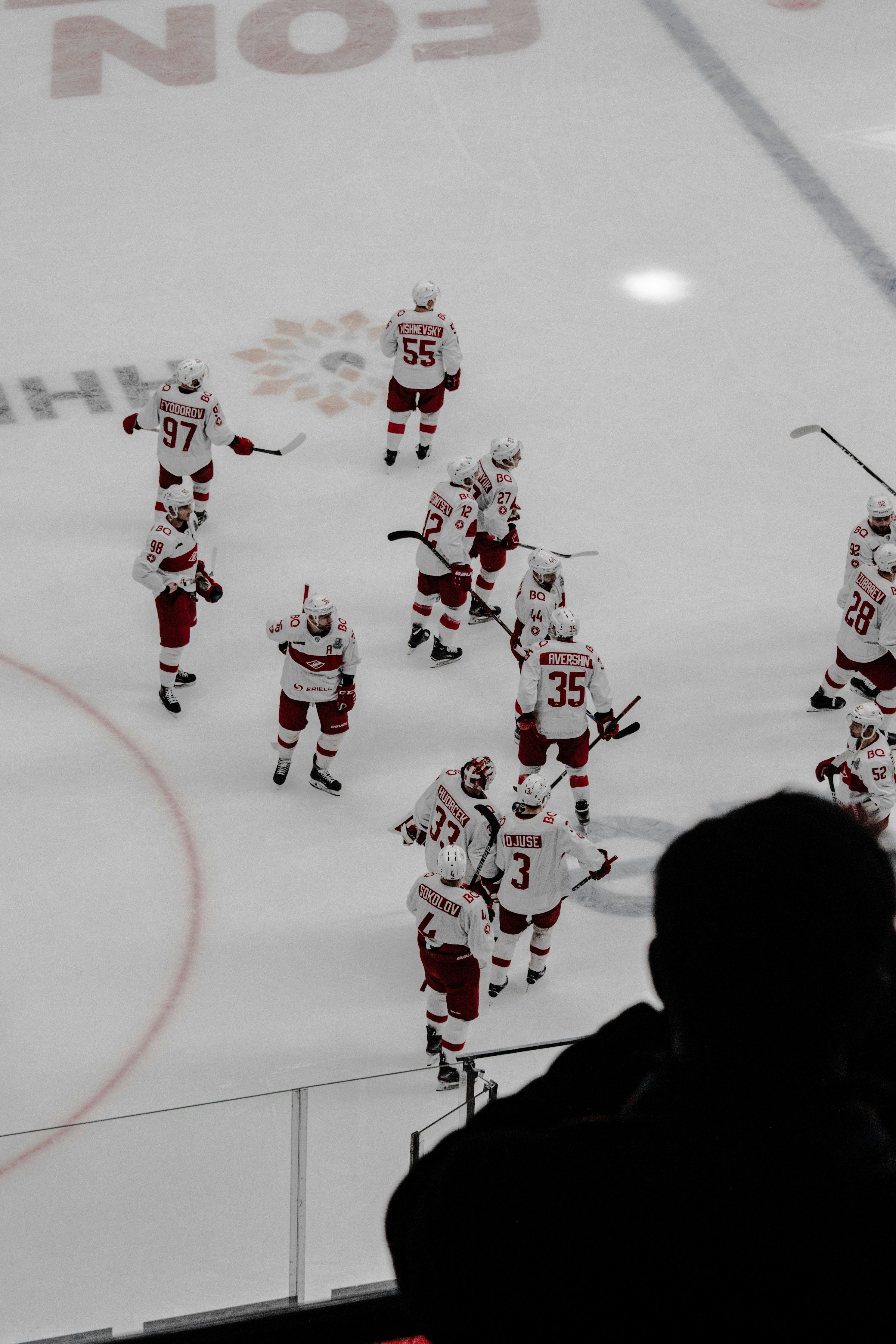 people in red and white ice hockey jersey